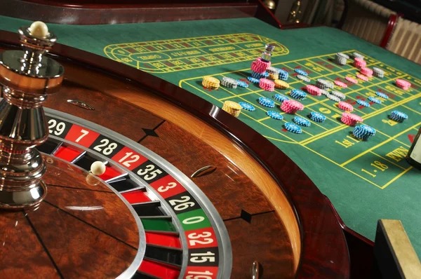 Roulette wheel spinning with betting board visible on mobile interface